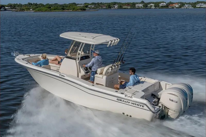The Image of 2026 Grady-White Fisherman 257 boat with dual Yamaha engines in a showroom. - 1