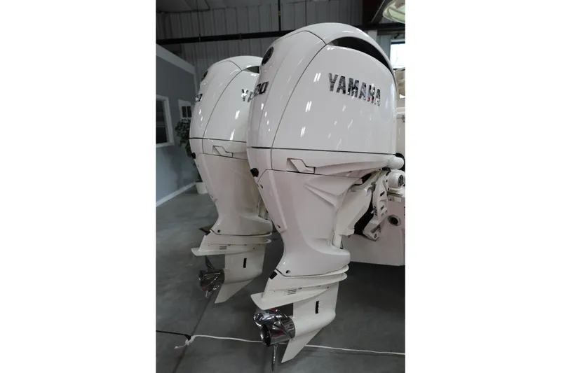 Slide: The Image of Twin Yamaha outboard engines on a 2026 Grady-White Fisherman 257 boat. - 12