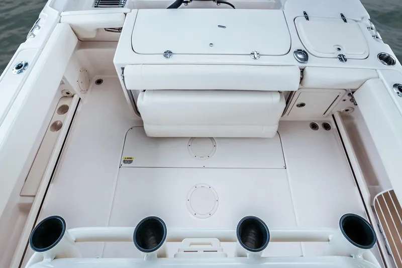 Slide: The Image of 2026 Grady-White Fisherman 257 boat top view with rod holders in a showroom. - 5