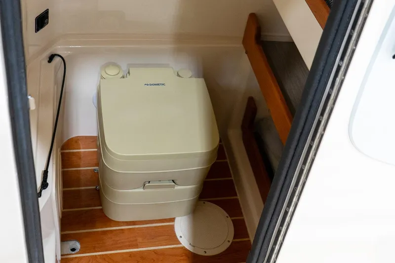 Slide: The Image of 2026 Grady-White Fisherman 257 boat console with steering wheel and controls. - 6