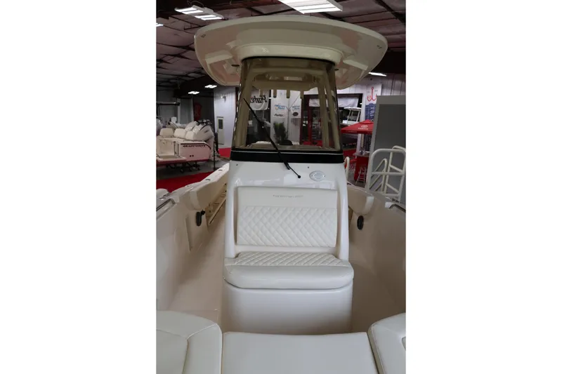 Slide: The Image of 2026 Grady-White Fisherman 257 boat interior with cushioned seating and helm station. - 9