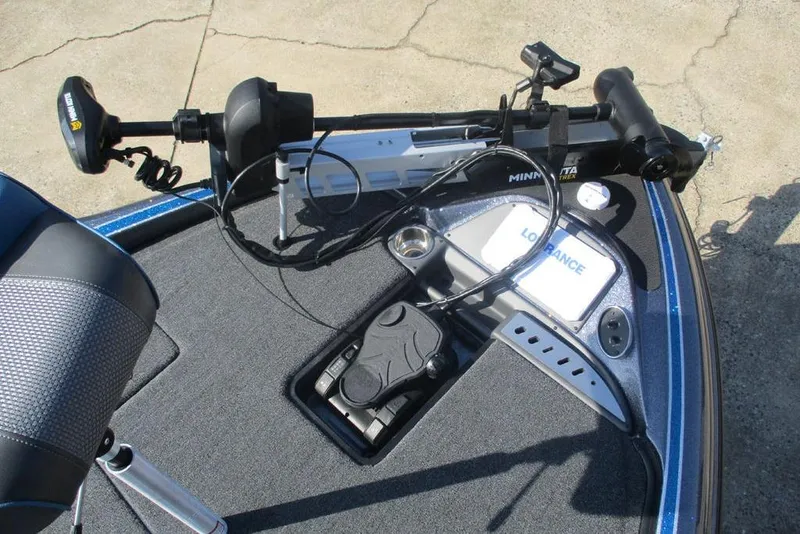 Slide: The Image of 2026 Triton 18 TrX boat deck with Minn Kota trolling motor and Lowrance electronics. - 10