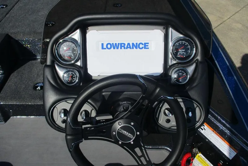 Slide: The Image of 2026 Triton 18 TrX boat dashboard with Lowrance display and gauges. - 9