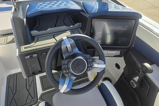 Slide: The Image of 2026 Tigé 22RZX boat dashboard with modern steering wheel and touchscreen display. - 5