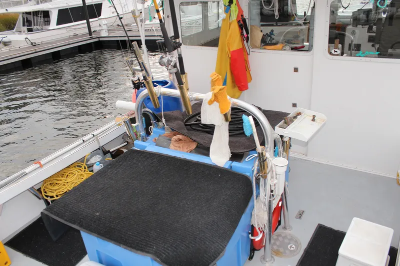 Slide: The Image of 2002 Libby 38 Downeast boat interior with fishing gear and equipment at dock. - 12