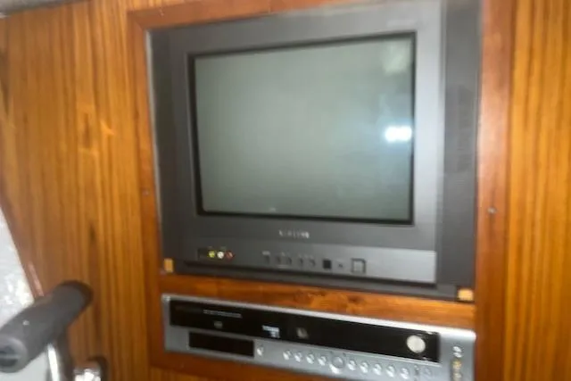 Slide: The Image of Vintage TV and DVD player in 2002 Libby 38 Downeast boat interior. - 26