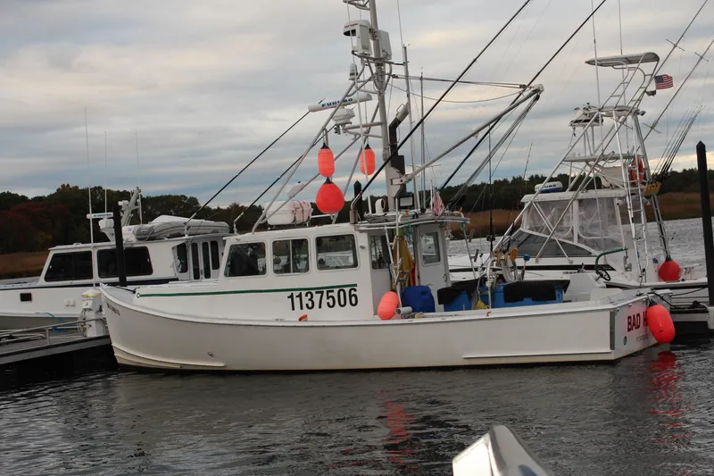 Slide: The Image of 2002 Libby 38 Downeast boat docked with fishing gear and buoys. - 6