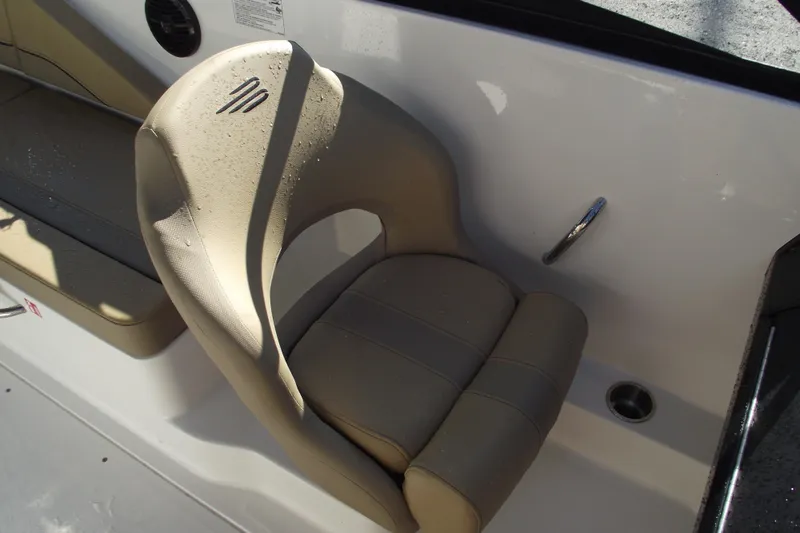 Slide: The Image of 2026 Bayliner V20 boat seat with beige upholstery and sleek design. - 22