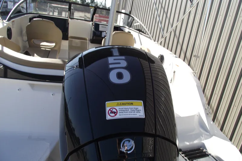 Slide: The Image of 2026 Bayliner V20 boat with powerful 150 HP engine, sleek design, and comfortable seating. - 5