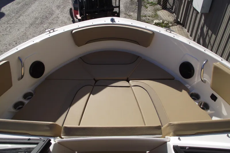 Slide: The Image of 2026 Bayliner V20 boat interior with beige seating and cup holders. - 6