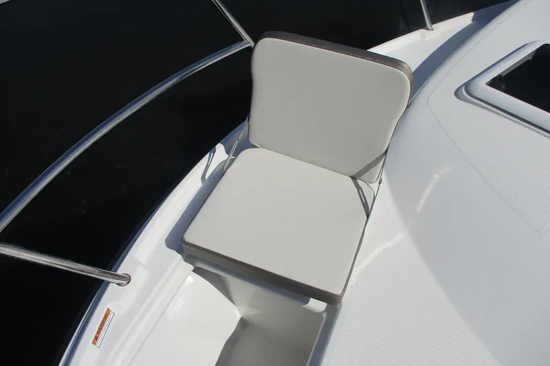 Slide: The Image of White cushioned seat on 2015 Cutwater 30 Command Bridge LE boat deck. - 11