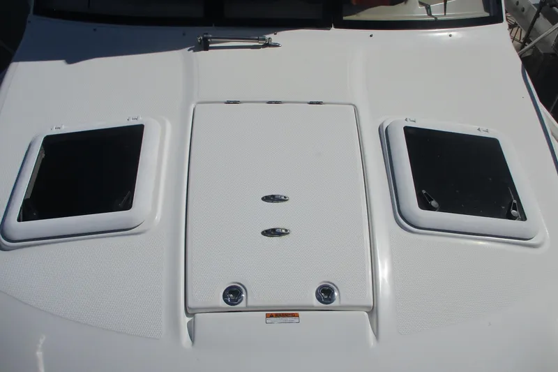 Slide: The Image of 2015 Cutwater 30 Command Bridge LE boat deck with hatches and textured surface. - 13