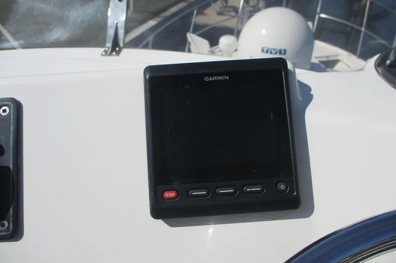 Slide: The Image of Garmin device on 2015 Cutwater 30 Command Bridge LE boat dashboard. - 16