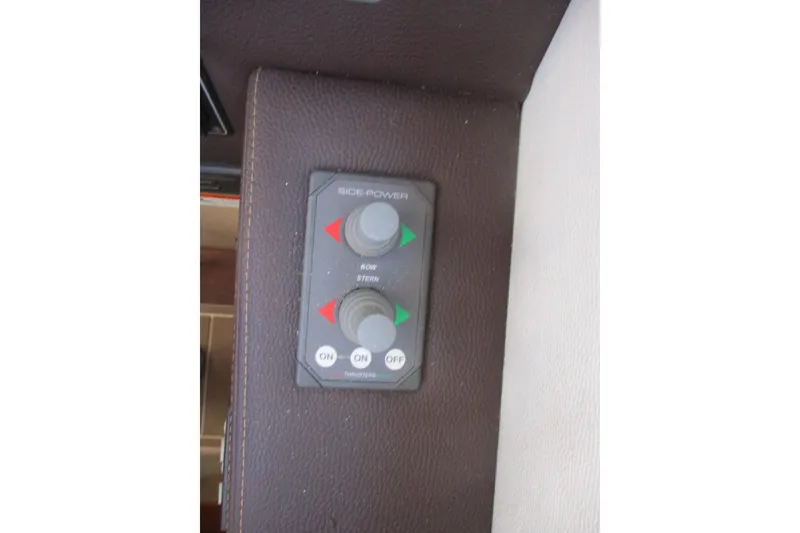 Slide: The Image of Control panel on 2015 Cutwater 30 Command Bridge LE boat, featuring bow and stern thruster controls. - 24