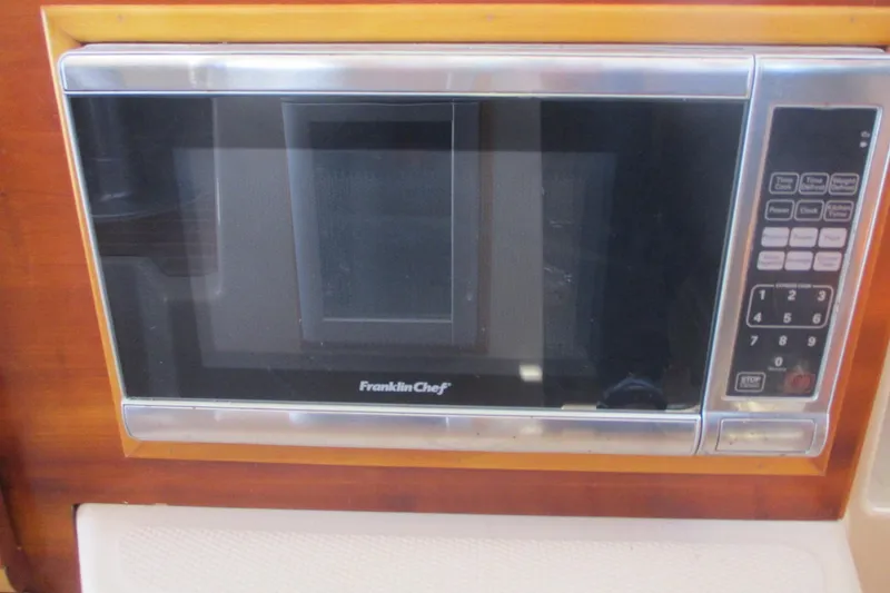 Slide: The Image of Franklin Chef microwave in 2015 Cutwater 30 Command Bridge LE boat kitchen. - 25