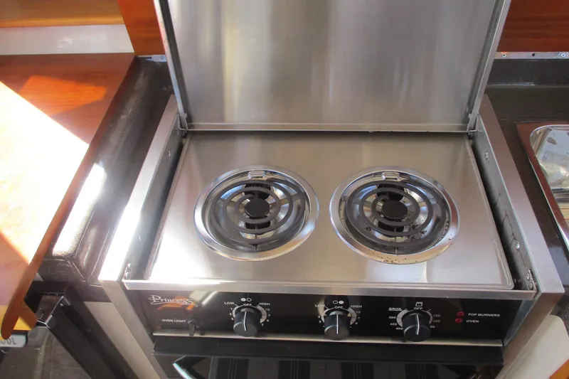Slide: The Image of Stainless steel stove in 2015 Cutwater 30 Command Bridge LE boat kitchen. - 29