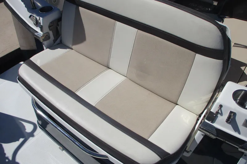 Slide: The Image of 2015 Cutwater 30 Command Bridge LE boat seat with beige and white upholstery. - 3