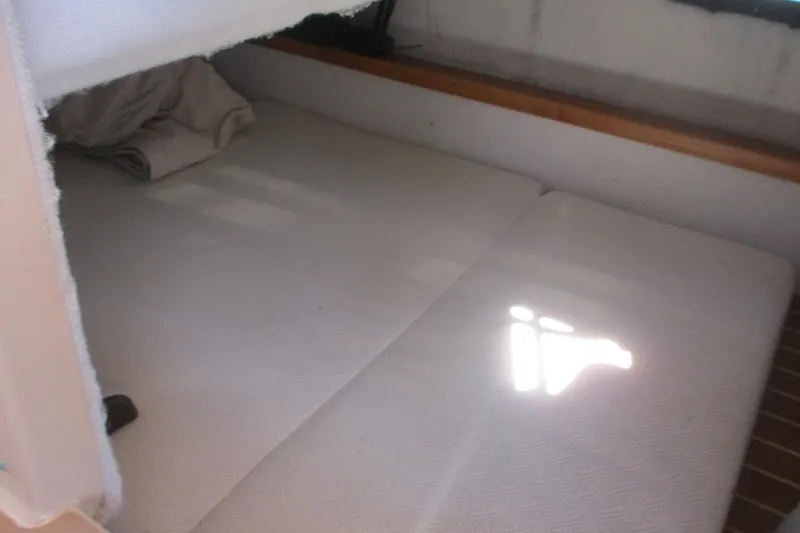Slide: The Image of Interior cabin of 2015 Cutwater 30 Command Bridge LE with cozy bedding. - 30