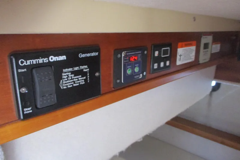Slide: The Image of Control panel of a 2015 Cutwater 30 Command Bridge LE with Cummins Onan generator. - 31