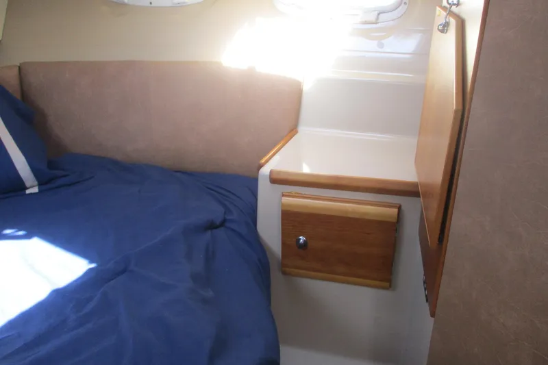 Slide: The Image of Interior cabin of 2015 Cutwater 30 Command Bridge LE with bed and storage. - 36