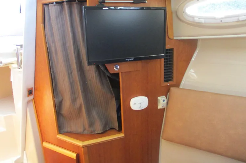 Slide: The Image of Interior of 2015 Cutwater 30 Command Bridge LE with TV and seating area. - 37
