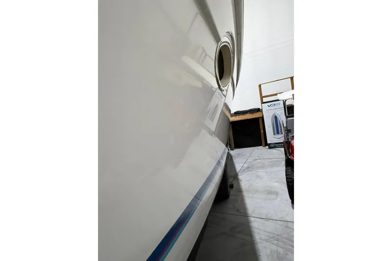 Slide: The Image of Anchor and rope stored in a compartment of a 1997 Formula 330 Sun Sport boat. - 10