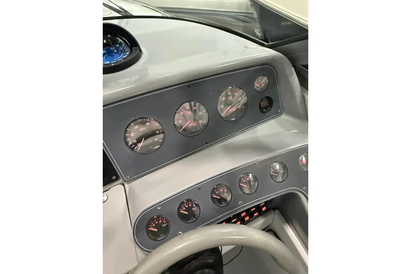 Slide: The Image of Side view of a 1997 Formula 330 Sun Sport boat in a storage area. - 11