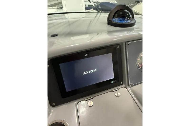 Slide: The Image of Dashboard of a 1997 Formula 330 Sun Sport boat with multiple gauges and controls. - 12