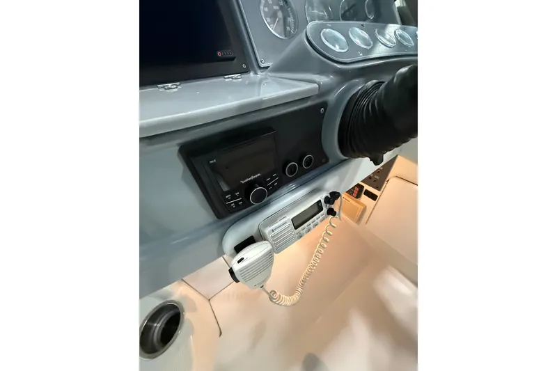 Slide: The Image of 1997 Formula 330 Sun Sport boat interior with white and blue seating. - 19