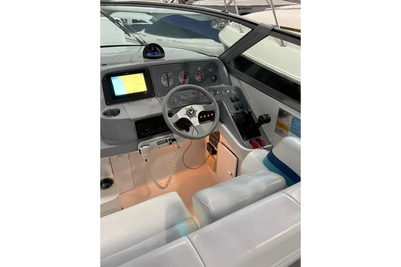 Slide: The Image of 1997 Formula 330 Sun Sport boat interior with seating and storage. - 22