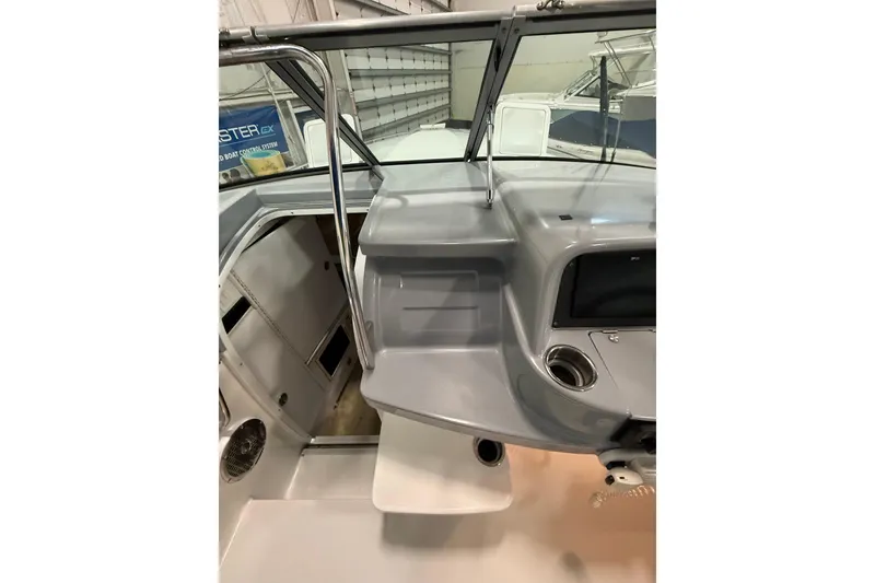 Slide: The Image of 1997 Formula 330 Sun Sport boat interior with helm and cabin entrance. - 24