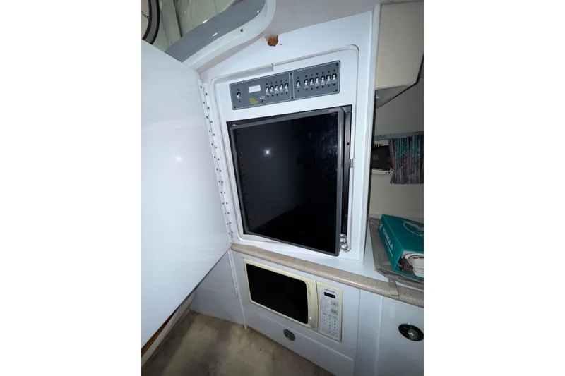 Slide: The Image of Interior of 1997 Formula 330 Sun Sport with control panel and microwave. - 26