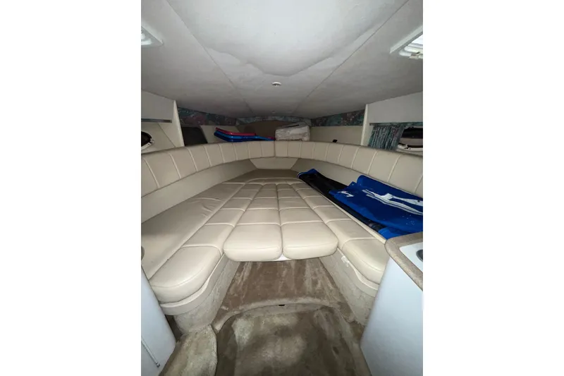 Slide: The Image of Storage compartment in a 1997 Formula 330 Sun Sport boat with fire extinguisher and supplies. - 27