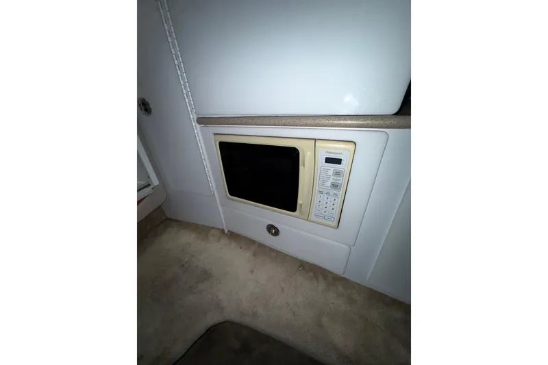 Slide: The Image of Control panel and outlets inside a 1997 Formula 330 Sun Sport boat. - 29