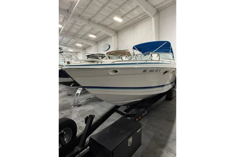 Slide: The Image of 1997 Formula 330 Sun Sport boat cockpit with steering wheel and navigation system. - 3