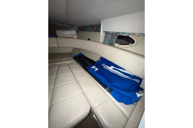 Slide: The Image of 1997 Formula 330 Sun Sport owner manual on a boat interior table. - 32
