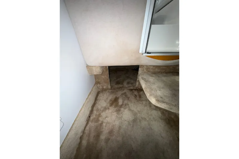 Slide: The Image of 1997 Formula 330 Sun Sport boat interior with blue canopy and open engine compartment. - 36