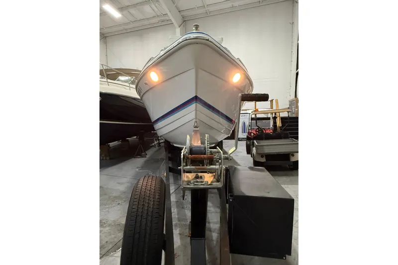 Slide: The Image of Interior cabin of 1997 Formula 330 Sun Sport boat with beige seating. - 4