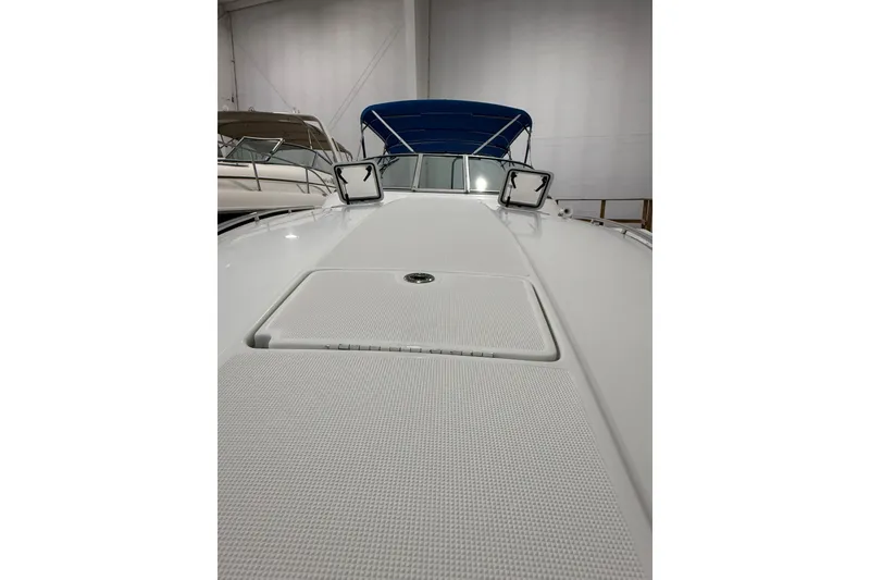 Slide: The Image of 1997 Formula 330 Sun Sport boat docked with blue cover and canopy. - 5