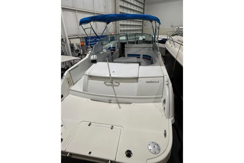 Slide: The Image of 1997 Formula 330 Sun Sport boat on trailer in indoor showroom. - 6