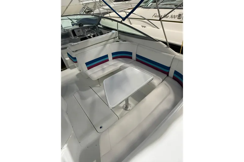 Slide: The Image of 1997 Formula 330 Sun Sport boat on trailer in indoor storage facility. - 7