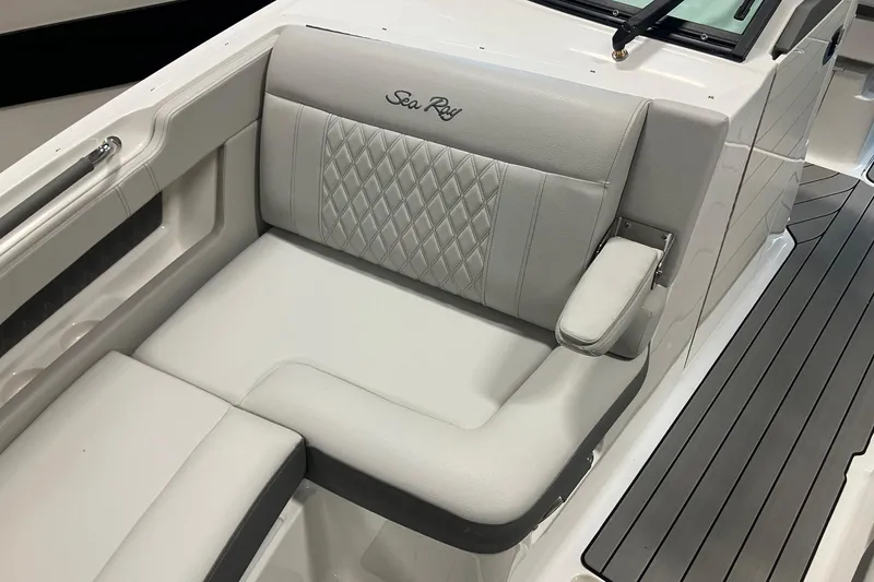 Slide: The Image of 2026 Sea Ray SLX 310 Outboard boat seat with elegant diamond stitching and armrest. - 19