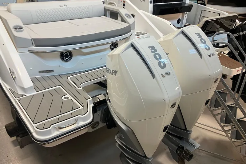 Slide: The Image of 2026 Sea Ray SLX 310 Outboard with dual Mercury 300 V8 engines, rear view. - 2