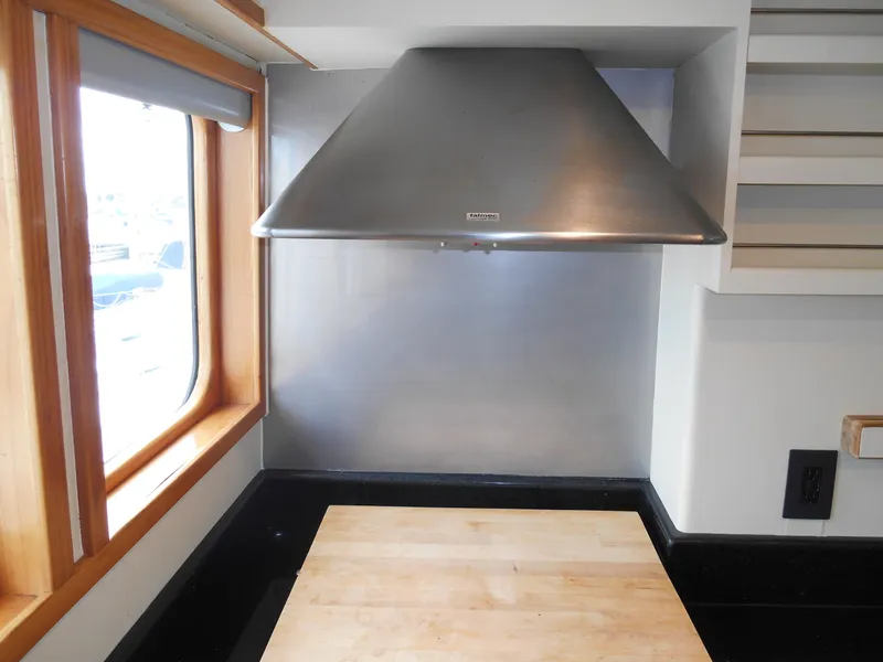 Slide: The Image of Stainless steel kitchen hood in 2005 Inace Trawler yacht interior. - 18