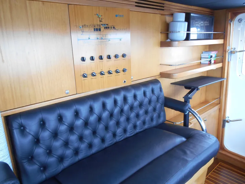 Slide: The Image of Luxurious 2005 Inace Trawler interior with leather seating and wooden paneling. - 23