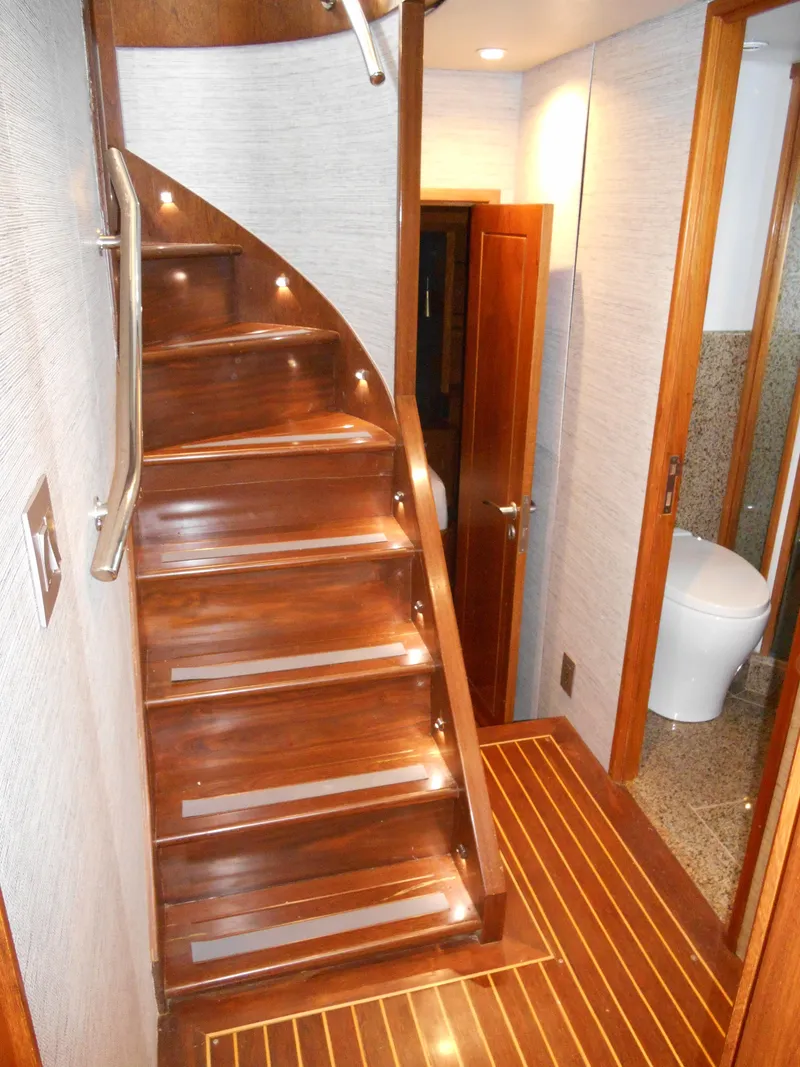 Slide: The Image of Wooden staircase with LED lights on a 2005 Inace Trawler yacht interior. - 34