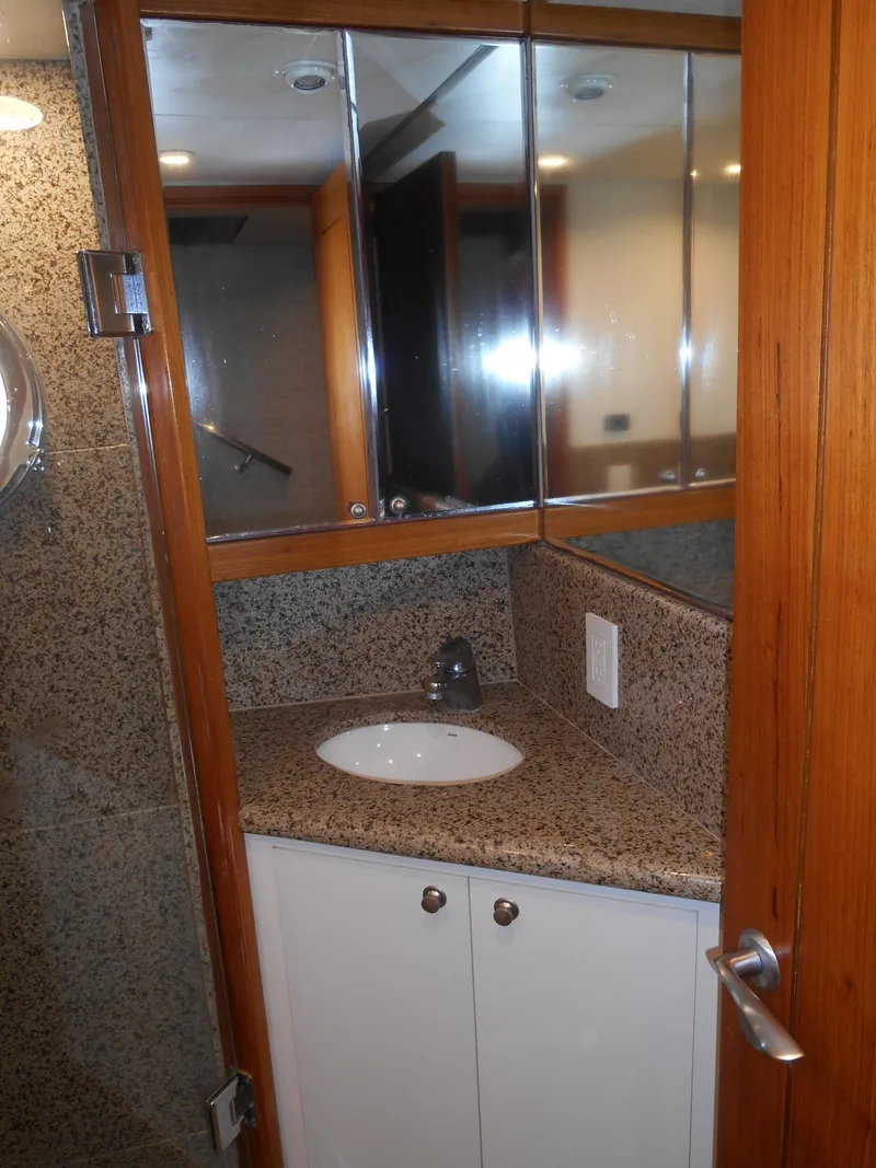 Slide: The Image of 2005 Inace Trawler bathroom with granite countertop and mirrored cabinets. - 39