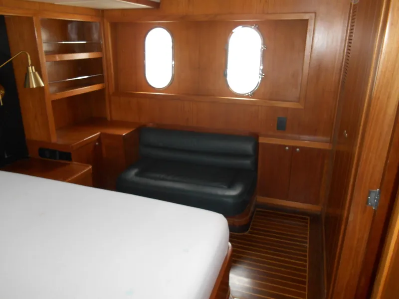 Slide: The Image of Luxurious 2005 Inace Trawler cabin with wood paneling and porthole windows. - 43