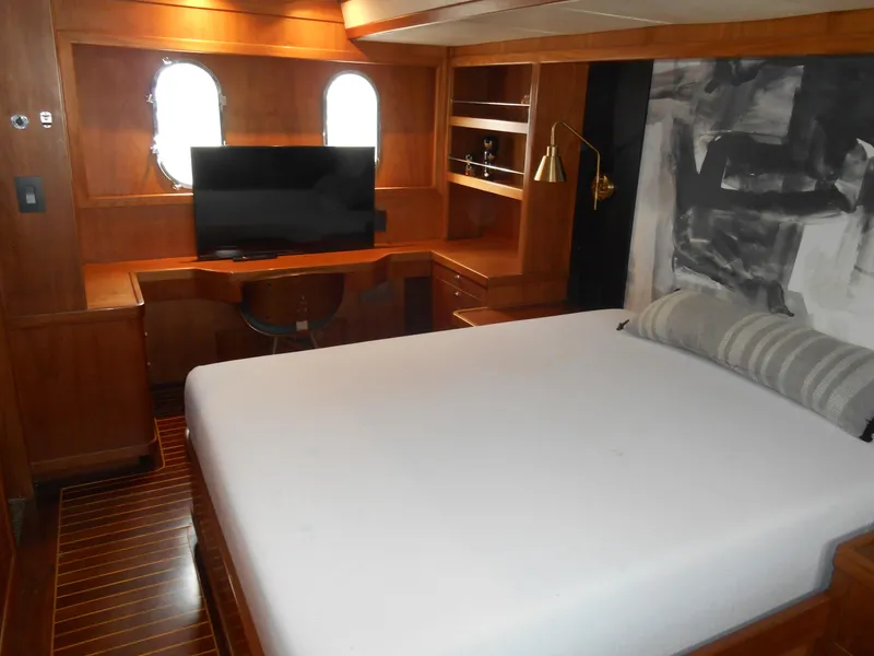 Slide: The Image of Luxurious 2005 Inace Trawler cabin with bed, TV, and wooden interior. - 44