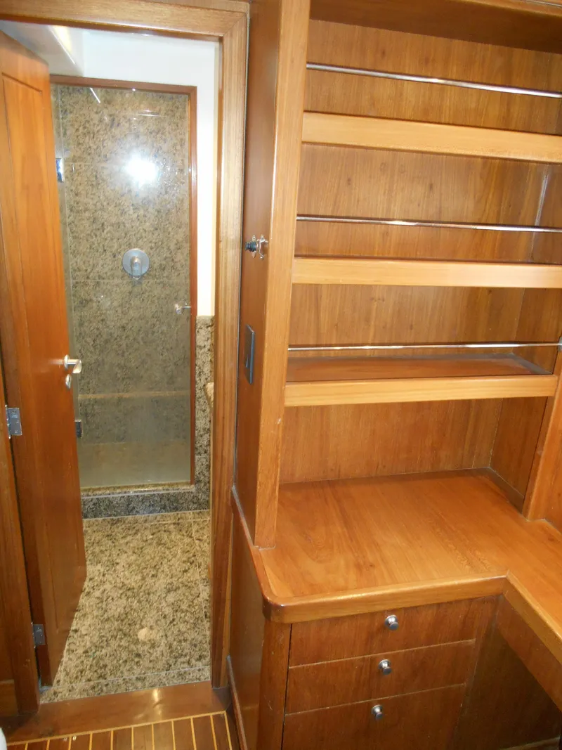 Slide: The Image of 2005 Inace Trawler interior with wooden shelves and granite shower. - 47